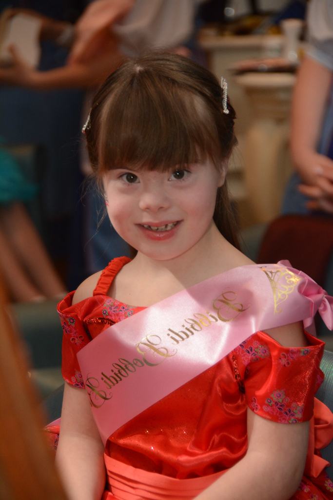 Child with down syndrome at beauty pageant
