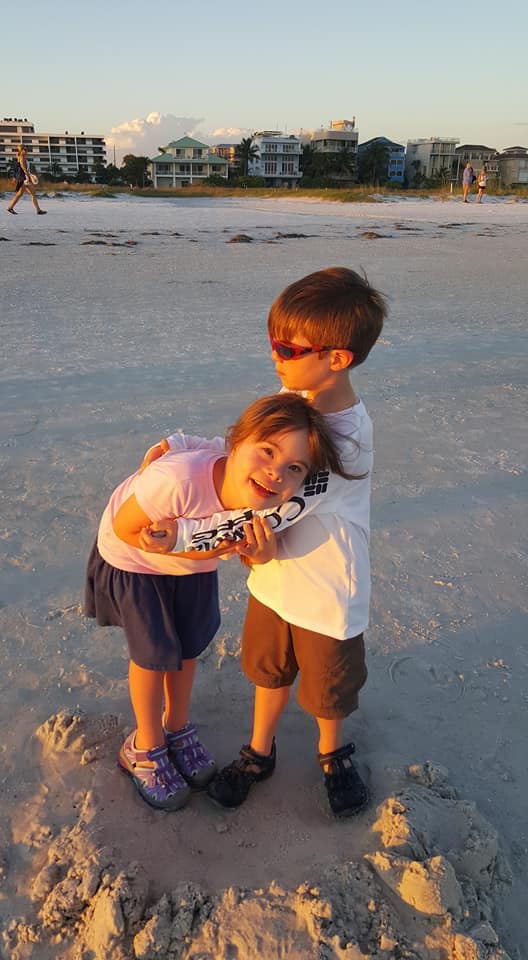 Brother and sister on the beach in Siesta Key, Florida